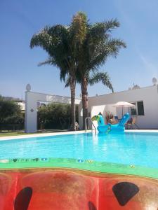 a swimming pool at a villa with a resort at Villa Carla in Cinisi