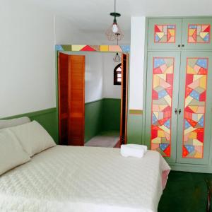 Tempat tidur dalam kamar di Pousada Videira de Teresópolis