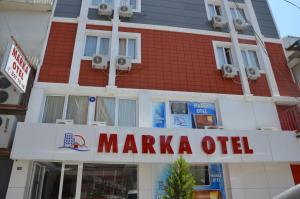 a maraka oil sign in front of a building at Marka Hotel in Antalya