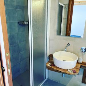 a bathroom with a sink and a shower at Residenza Matilde in Fiumefreddo Bruzio
