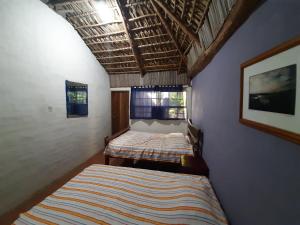 Ένα ή περισσότερα κρεβάτια σε δωμάτιο στο Capricho Beach House
