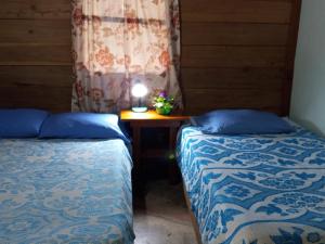 Postel nebo postele na pokoji v ubytování Clarissa Falls Resort