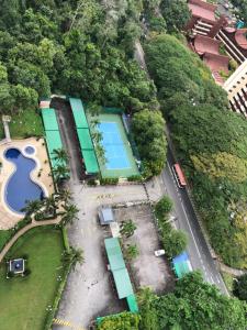 an overhead view of a park with a tennis court at Beach Resort HOME STAY SRI SAYANG 05 APARTMENT BATU FERRINGHI 2BEDROOM in Batu Ferringhi