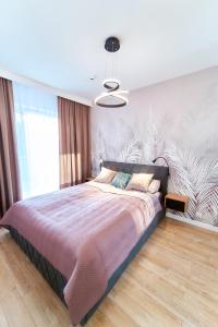 Ένα ή περισσότερα κρεβάτια σε δωμάτιο στο LAGUNA Apartament Polanica Residence 39