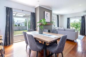 a dining room with a table and chairs at Brooklands Cottage The Award Winning Villa in Martinborough