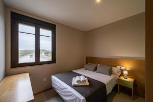 Łóżko lub łóżka w pokoju w obiekcie APARTAMENTOS LAS OLAS BY PANTIN