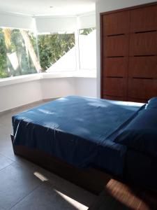 Una cama o camas en una habitación de La Villa de Almudena