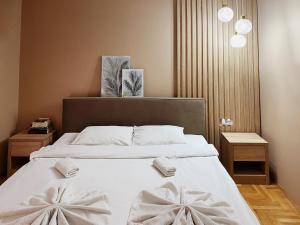A bed or beds in a room at Apartmani Banja SPA