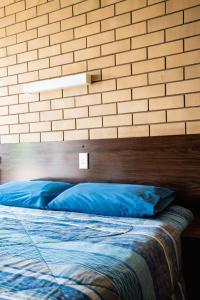 Postel nebo postele na pokoji v ubytování Grand Hotel Motel