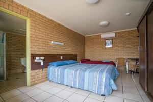 Postel nebo postele na pokoji v ubytování Grand Hotel Motel