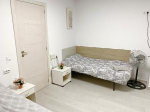 Postel nebo postele na pokoji v ubytování Casa Sergio de Novelda