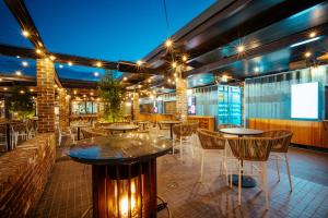 a restaurant with tables and chairs and lights at Barrack Point Holidays in Barrack Point