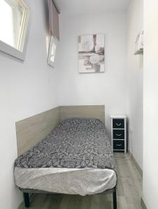 a bed sitting in a room with at Casa Ekaterina de Novelda in Novelda