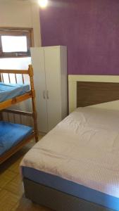 Postel nebo postele na pokoji v ubytování RESIDENCIAL FÁVERO