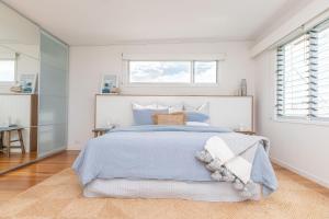Postel nebo postele na pokoji v ubytování Akoakoa - Sunrise Beach
