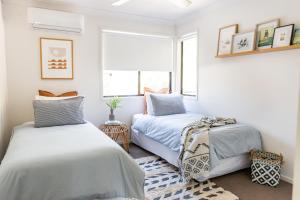Postel nebo postele na pokoji v ubytování Akoakoa - Sunrise Beach