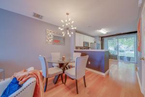 a kitchen and dining room with a table and chairs at The Lux At Lake Mary in Lake Mary
