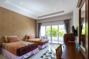 Ein Bett oder Betten in einem Zimmer der Unterkunft Nature Line Resort