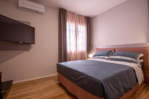 Postel nebo postele na pokoji v ubytování Villa Elia Suite Room