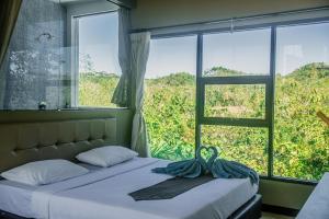 Postel nebo postele na pokoji v ubytování Bombora Surf Camp
