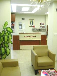 a hospital lobby with a reception desk and a waiting room at Gelibolu Hotel in Gelibolu