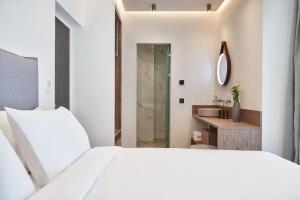 A bed or beds in a room at NLH KERAMEIKOS - Neighborhood Lifestyle Hotels