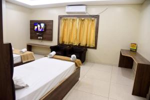TV a/nebo společenská místnost v ubytování Hotel Guru Estate