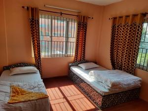 Una cama o camas en una habitación de Homestay in Nagarkot