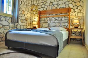 Ένα ή περισσότερα κρεβάτια σε δωμάτιο στο Stone Villa Kefaloniaprivatevillas +21 φωτογραφίες