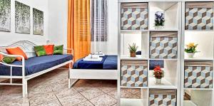 Posteľ alebo postele v izbe v ubytovaní Zanzi 's Apartments