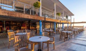 a row of tables and chairs on a patio at Armas Beach in Kemer