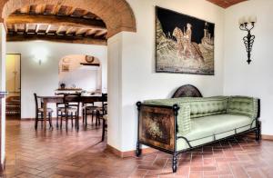 a living room with a couch and a table at B&B Antiche Rime in Gaiole in Chianti