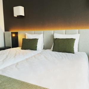 Postel nebo postele na pokoji v ubytování Factory Hotel