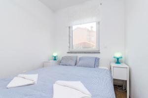 Ένα ή περισσότερα κρεβάτια σε δωμάτιο στο MARINA VIEW APARTMENT