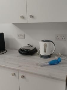 a counter top with a toaster and a toaster at Andri' s place in Nea Paphos