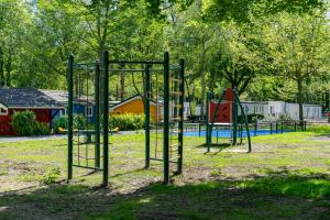 an empty park with a playground with a slide at EuroParcs Het Amsterdamse Bos in Amstelveen