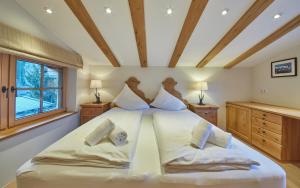 a bedroom with two beds in a room at Chalet Tannenbaum in Saalbach-Hinterglemm