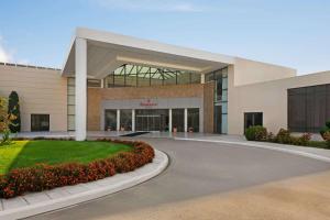 a large building with a road in front of it at Ramada Plaza by Wyndham Thraki in Alexandroupoli