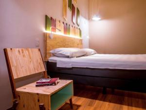 Postel nebo postele na pokoji v ubytování Hotel Nacional Inn Curitiba Santa Felicidade