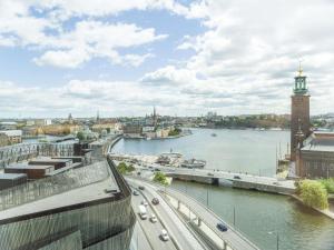 a city street with a bridge and a clock tower at Radisson Blu Waterfront Hotel, Stockholm in Stockholm