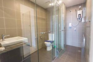 a bathroom with a shower and a toilet and a sink at KK studio [B]/2 Queen Bed/ Netflix/Free Parking in Kota Kinabalu