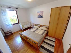 Posteľ alebo postele v izbe v ubytovaní Apartment Toni Valbandon