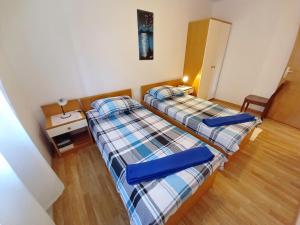 Posteľ alebo postele v izbe v ubytovaní Apartment Toni Valbandon