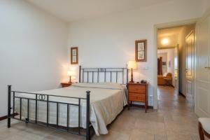 A bed or beds in a room at Poggio all'Agnello Sport & Family Holidays