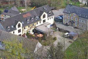 an aerial view of a hotel and a building at Elegant-Hotel "Zur Burg" in Posterstein