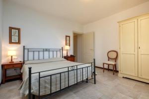 A bed or beds in a room at Poggio all'Agnello Sport & Family Holidays