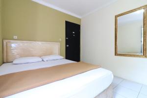 Voodi või voodid majutusasutuse AMS Hotel Koja toas
