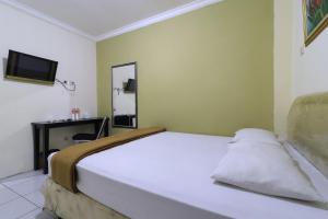 Voodi või voodid majutusasutuse AMS Hotel Koja toas