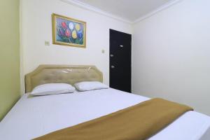 Voodi või voodid majutusasutuse AMS Hotel Koja toas