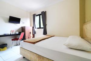 Voodi või voodid majutusasutuse AMS Hotel Koja toas